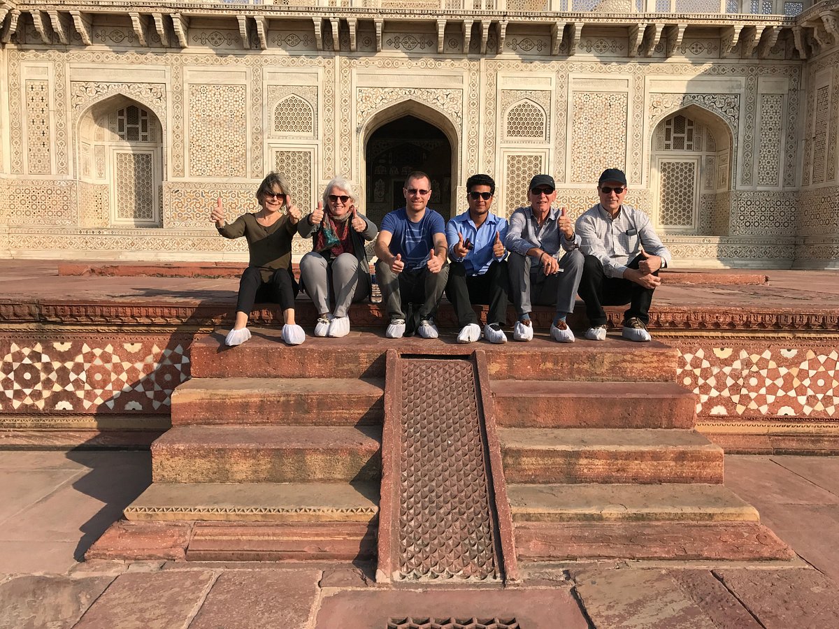 Six travelers on the steps of Itimad-ud-Daulah, the Baby Taj, in Agra
